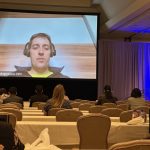 Dr. Schapranow, NephroCAGE consortium lead, on screen at ASHI 2022. (Photo M. Niemann)
